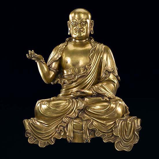 A GILT-BRONZE FIGURE OF A LUOHAN