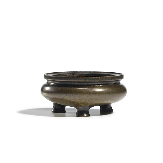 A BRONZE TRIPOD CENSER