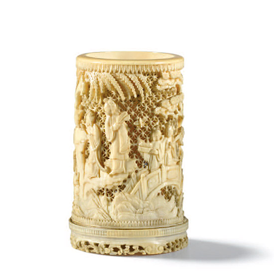 A CARVED IVORY BRUSHPOT