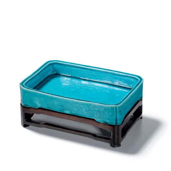 A TURQUOISE-GLAZED WASHER