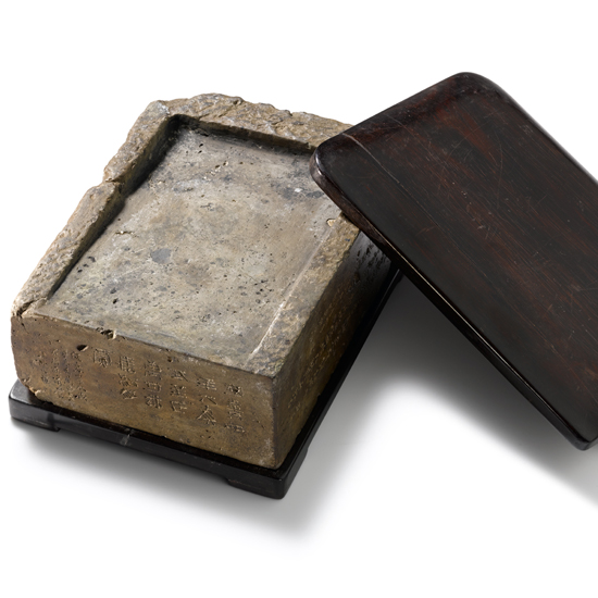 A HAN ‘BRICK’ INKSTONE WITH AN ACCOMPANYING BOOK OF ILLUSTRATIONS