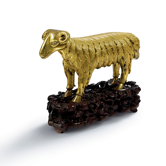 A GILT BRONZE RAM