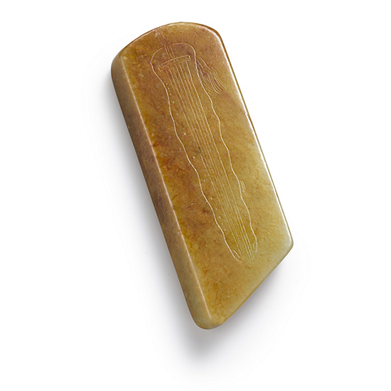 AN IMPERIALLY INSCRIBED YELLOW JADE PAPERWEIGHT