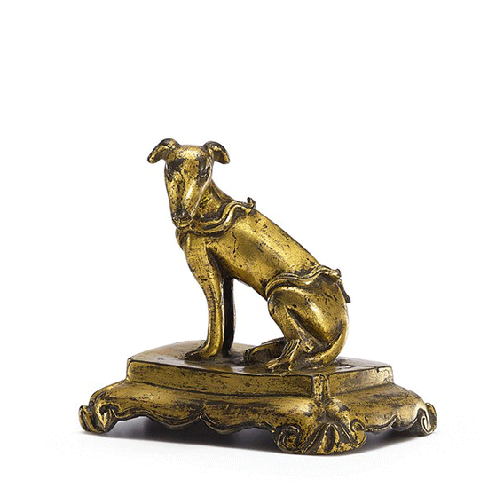 A GILT-BRONZE FIGURE OF A DOG