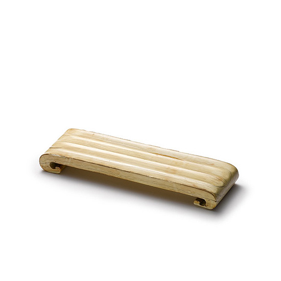 A CARVED IVORY INK REST